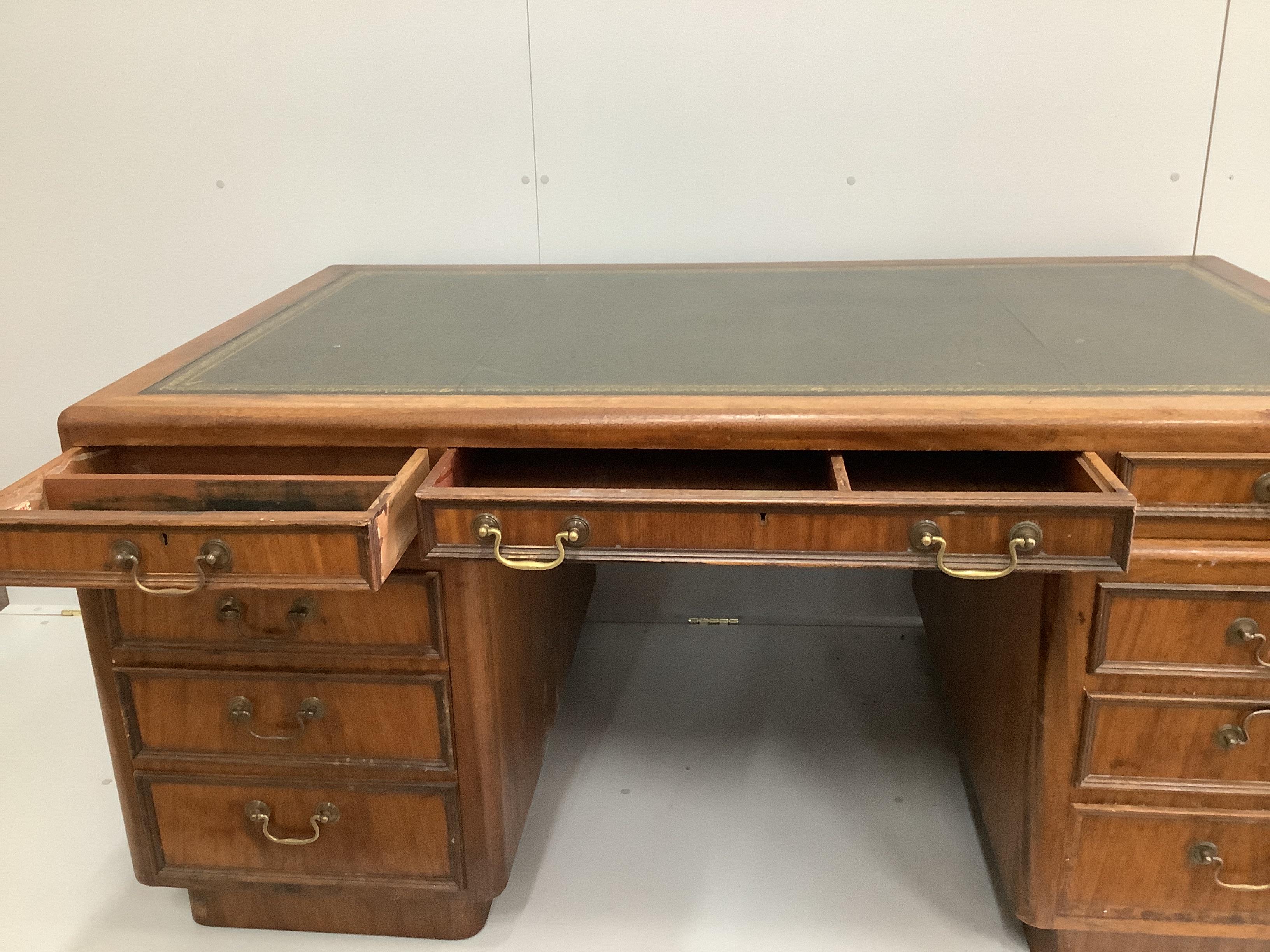 A mid century mahogany pedestal desk, width 162cm, depth 93cm, height 76cm